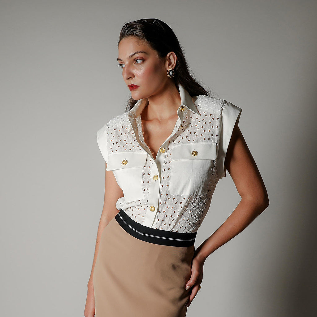 Model wearing the Realm Origin Aura State Shirt in white embroidered cotton anglaise with gold buttons and contrast sateen detailing. Mobile banner for The Vérité Edit collection.