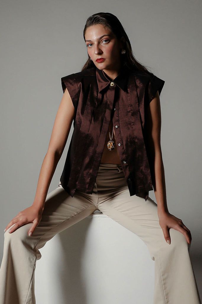 Hero front product image of the Realm Origin Sol Verite Shirt in Mocha taffeta, sleeveless structured tageeta shirt with flange pleats, step hem and tailored shoulders, styled on-model.