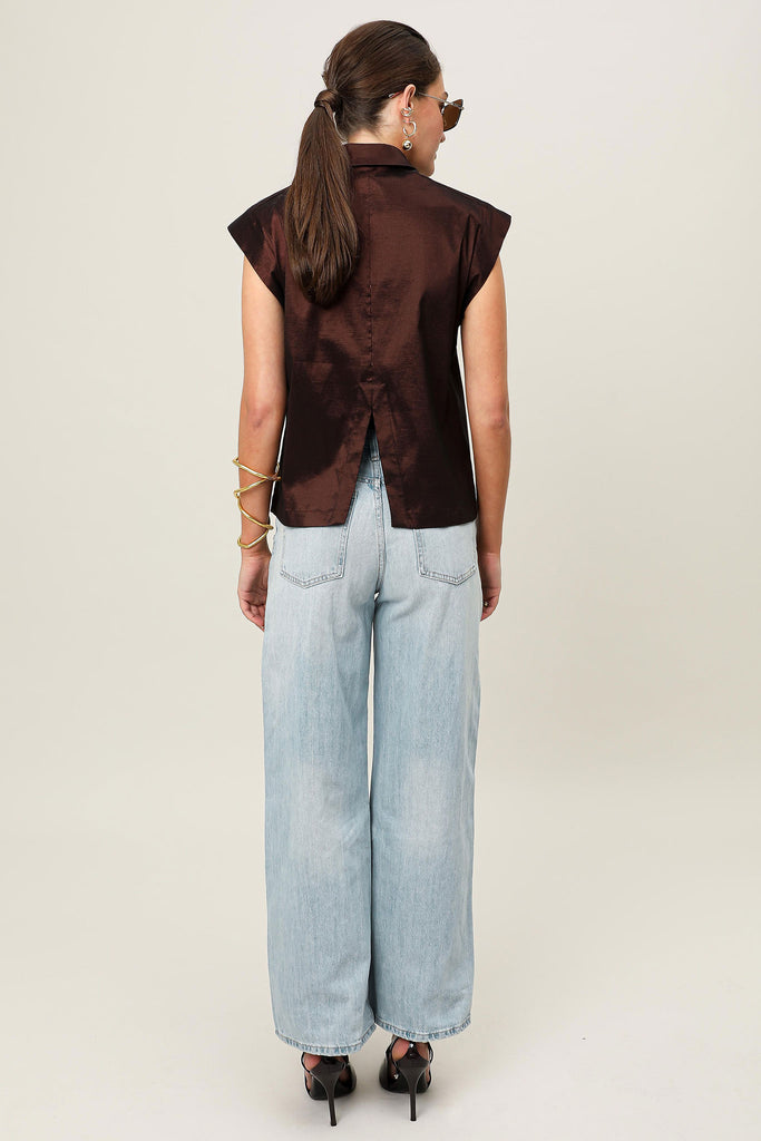 E-commerce back profile of the Relam Origin Sol Verite Shirt in mocha brown, structured sleeveless taffeta shirt featuring step hem, back vent and tailored shoulder line, shown on model.