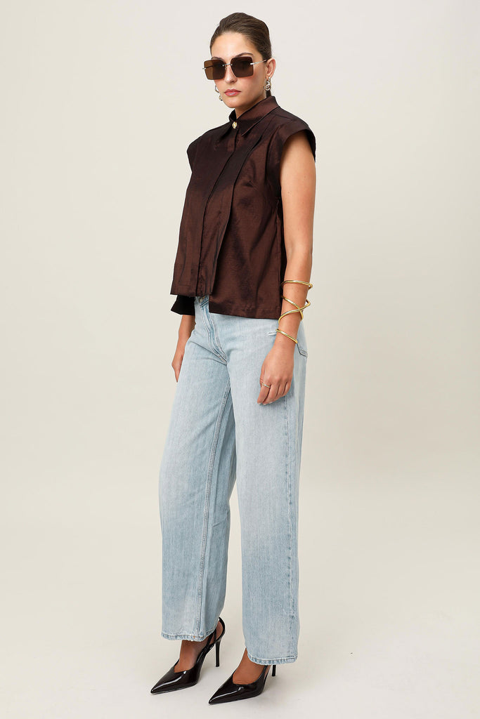 E-commerce side profile of the Realm Origin Sol Verite Shirt in Mocha brown, sleeveless structured taffeta shirt featuring front flange pleats, shoulder pads and step hem.